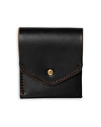 Black leather pouch with a gold button on a white background